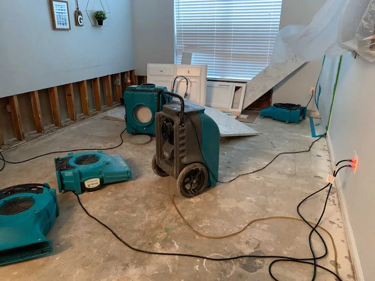 Dehumidifier in flood-cut room for Water Damage Restoration in Crofton